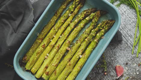 Close-up-with-selective-focus-on-roasted-asparagus-seasoned-with-salt--pepper--garlic