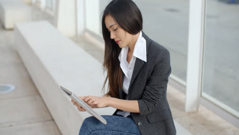 Calm-professional-woman-using-tablet