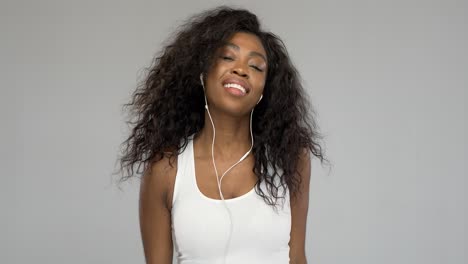 Black-woman-listening-to-music-and-smiling