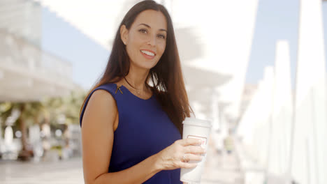 Attractive-woman-holding-a-large-cup-of-coffee