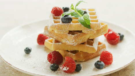 Waffles-served-on-plate-with-berries