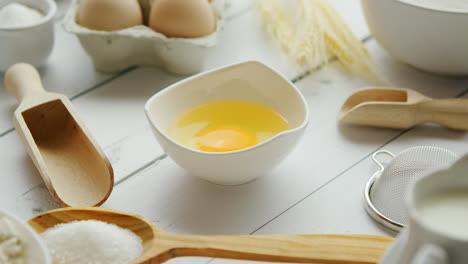 Utensils-and-ingredient-around-bowl-with-yolk
