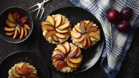 Delicious-homemade-mini-tarts-with-fresh-sliced-plum-fruit