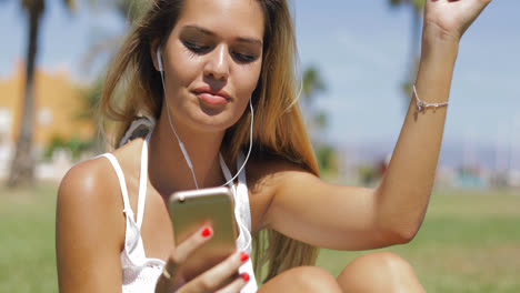 Charming-girl-with-phone-and-headphones