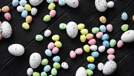 Easter-holidays-concept--Colorful-different-kinds-of-eggs-placed-on-black-wood