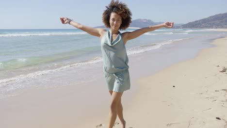Female-wearing-summer-jumpsuit-posing-on-beach