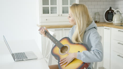 Woman-playing-electric-guitar