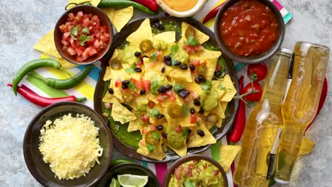 Mexican-nachos-tortilla-chips-with-black-bean--jalapeno--guacamole