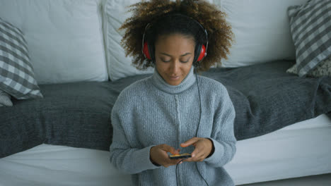 Content-woman-listening-to-music-at-home