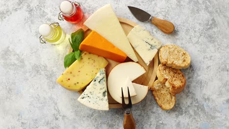 Various-types-of-cheese-served-on-rustic-wooden-board