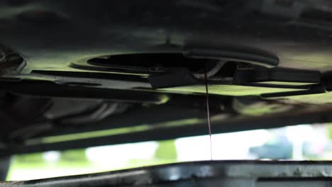 Draining-oil-from-a-car-slowly