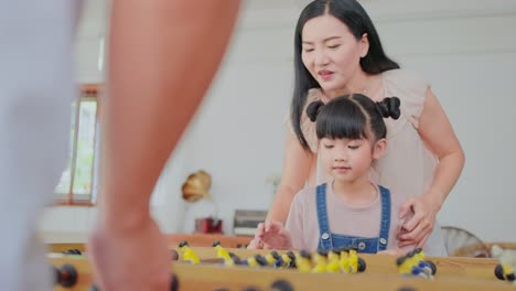 family playing foosball