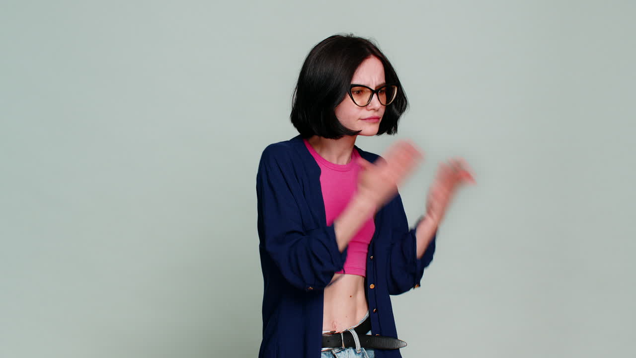 Young woman ironically shaking head showing obvious gesture clearly indicating sarcastic disbelief