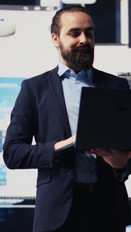 vertical video young startup entrepreneur uses materials and analytics to improve development
