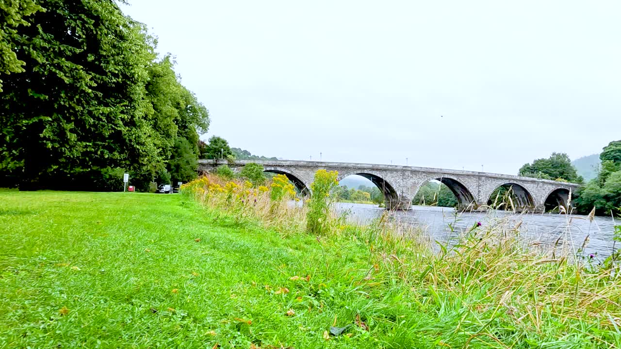 A serene view of a historic stone bridge