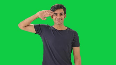 proud indian boy saluting  green screen