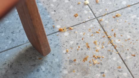 bread crumbs on tile floor