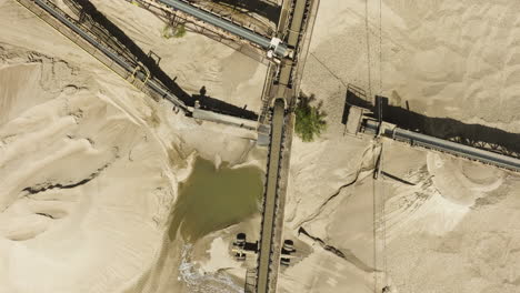 Overhead-View-Of-Conveyor-Belt-System-In-Sand-And-Gravel-Pit-On-A-Sunny-Day-In-Van-Buren,-Arkansas,-USA