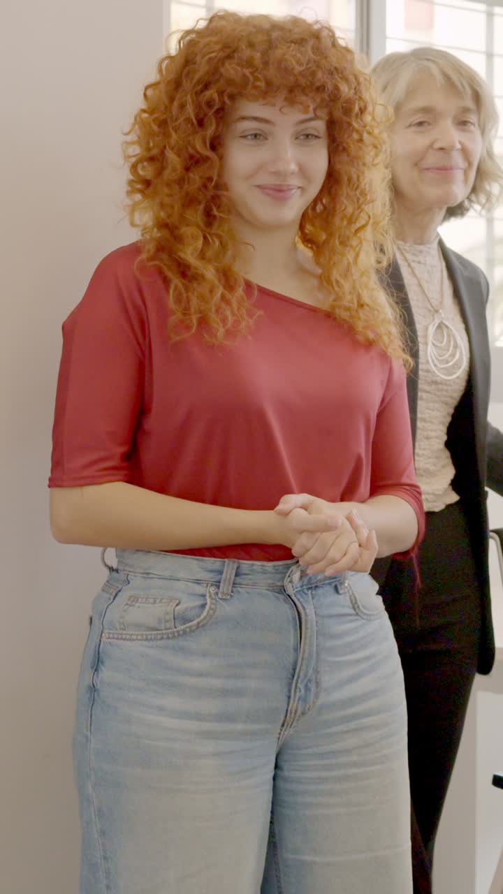 Boss talking to workers in a meeting in a coworking