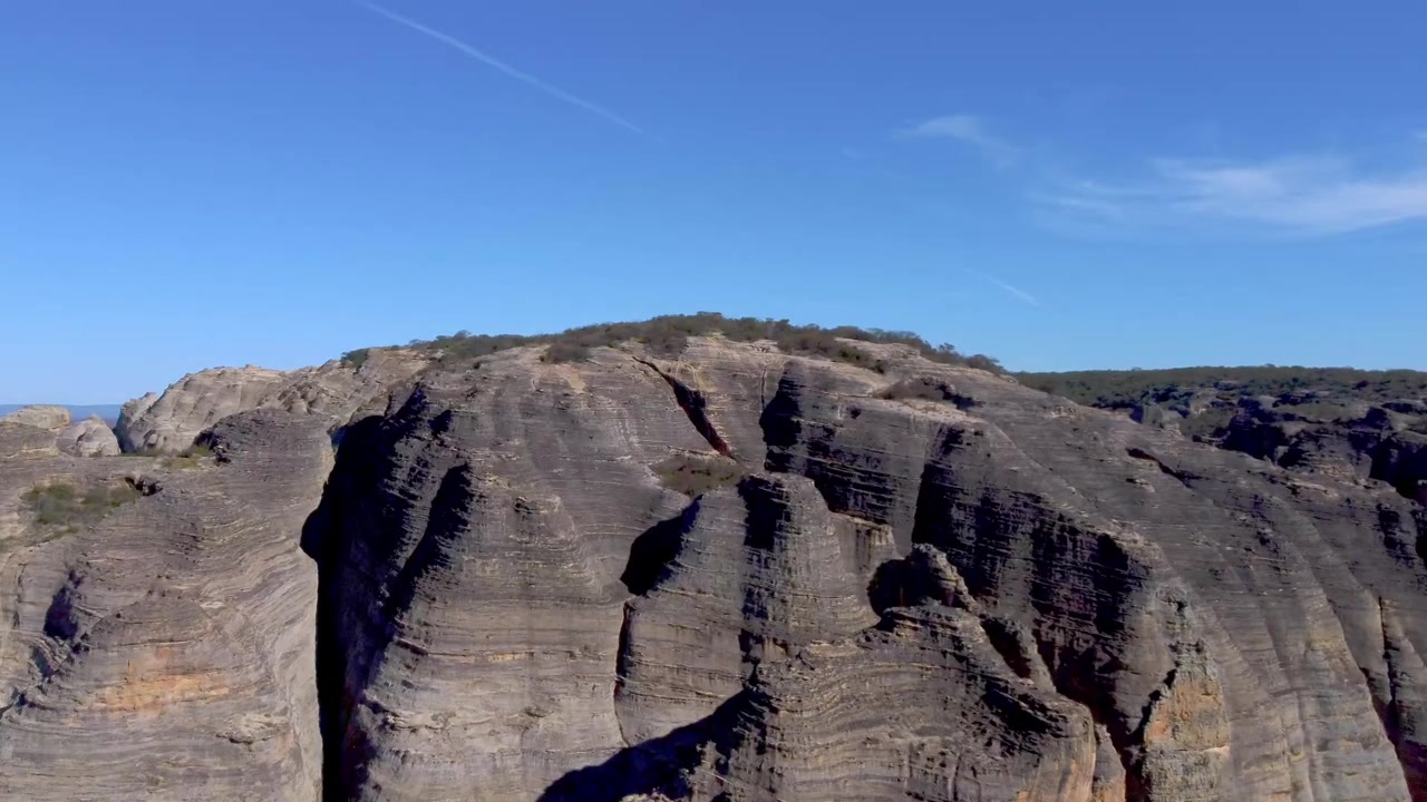 High-angle aerial shot highlighting the incredible textures of massive rock domes and geological formations in Serra da Capivara National Park.