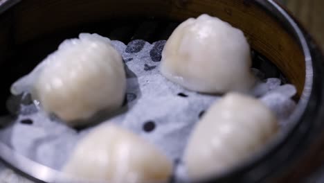 dim sum dumplings steaming in bamboo basket