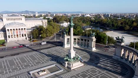 arcing aerial reveals heroes' square with millennium monument, budapest, hungary