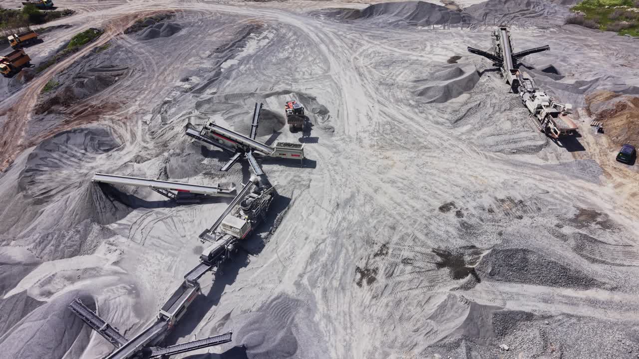 Aerial View of a Quarry with Heavy Machinery and Conveyor Belts