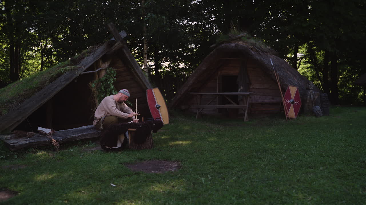 Viking Craftsman Working in a Historical Village Reconstruction