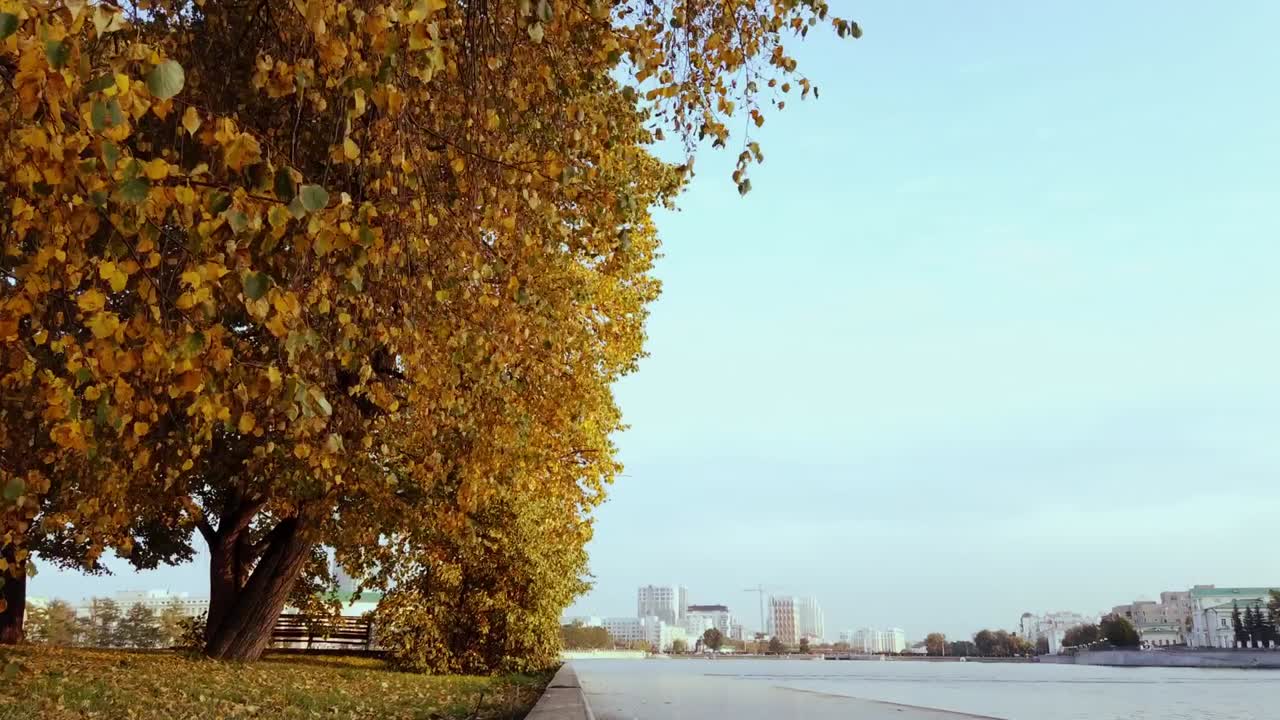Time lapse of a sunny park people are walking, taking photos in Ekaterinburg, Russia