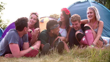 friends having fun on the campsite at a music festival