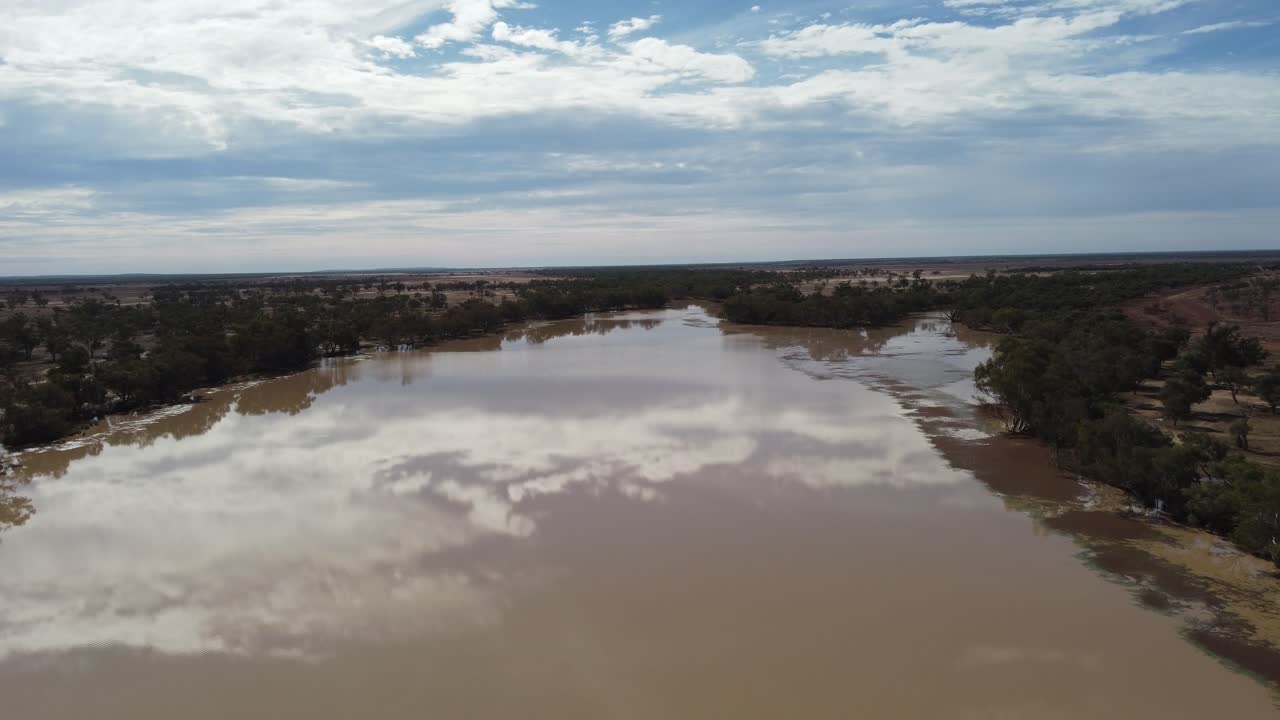 Flying over a lake in the Outback of Australia showing the reflections of the clouds
