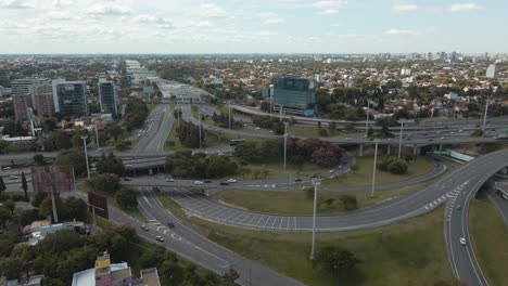 aerial view of panamericana highway and general paz avenue interchange with commuters