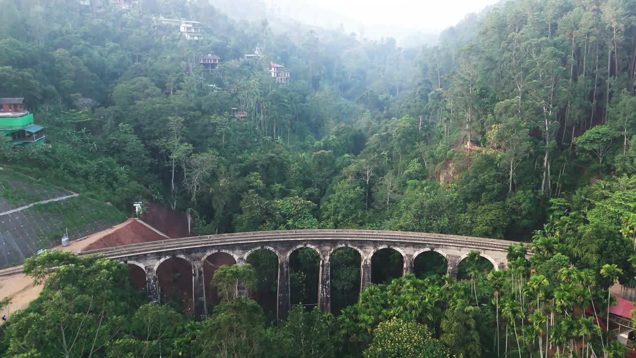 Fly towards the nine arches bridge, morning mist