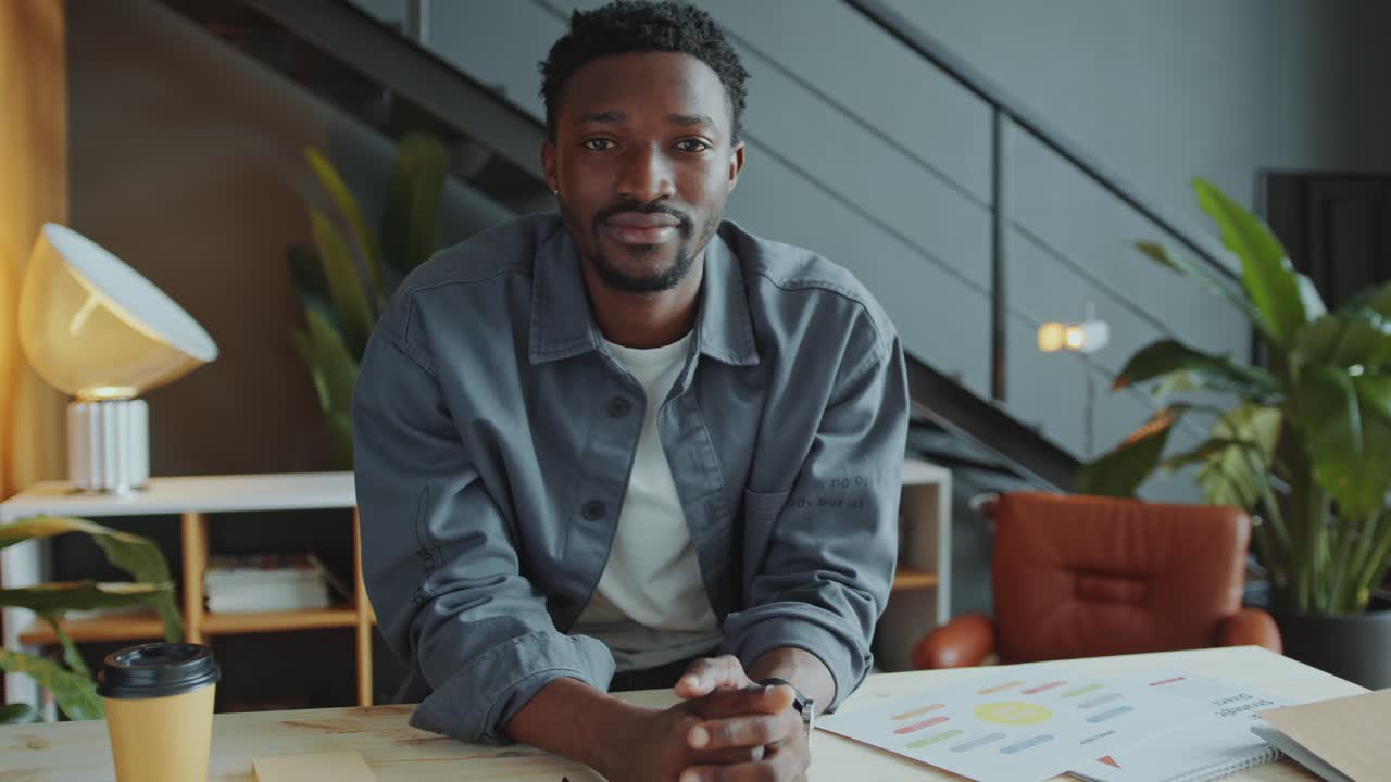Portrait of Smiling African American Businessman in Casual Wear at Office Desk