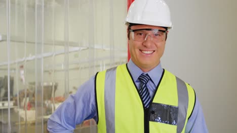 Portrait-of-inspection-officer-holding-clipboard