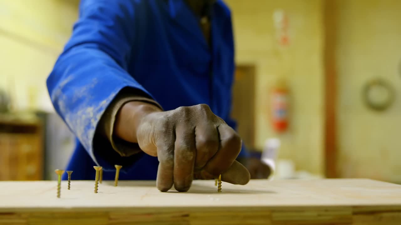 Close-up of male worker working in foundry workshop 4k