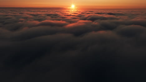 sunrise/sunset over clouds - aerial view