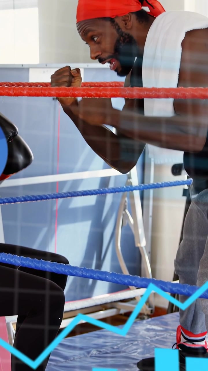Vertical video: Boxing coach entering ring coaching and showing guard HUD by face chart moving low