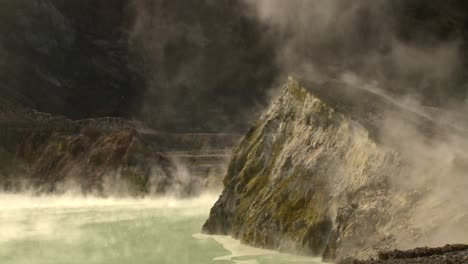 steam rises from volcanic vents in a crater on the small new zealand island of whaakari 2