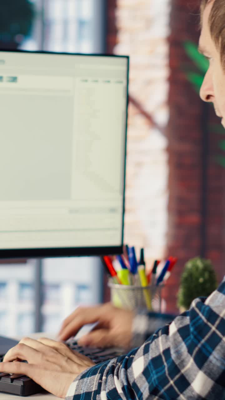 Vertical video Software engineer at PC coding, creating software using isolated screen tablet