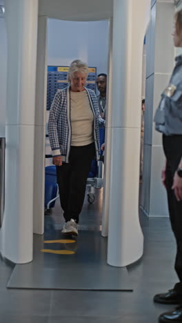 airport security check of elderly passenger