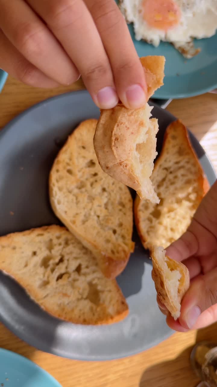 Breakfast with fried eggs, toast and potatoes