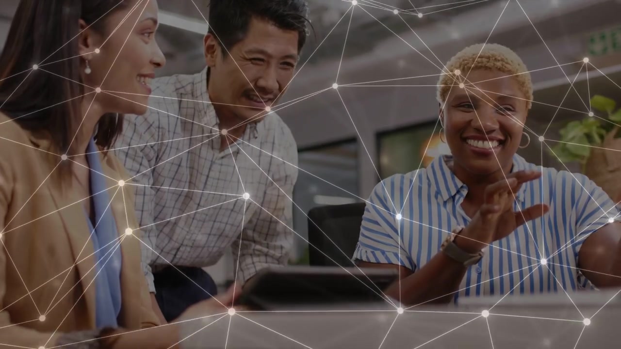 Business team leaning over tablet, right woman speaking, pointing for project overlay across frame