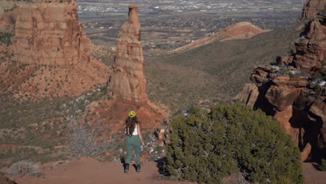 back view of young woman on viewpoint in