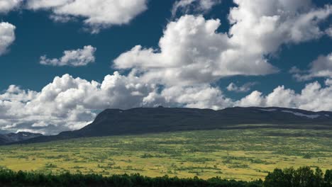 Huge-cumulus-clouds-are-gaining-their-shape-and-expanding-in-the-air-whirlwinds-above-the-horizon