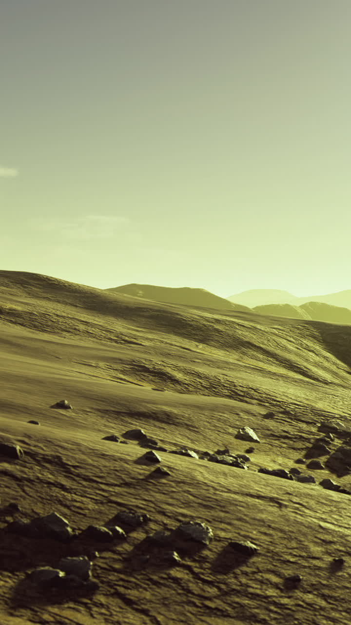 Vast landscape in gentle sunlight with rolling hills and rocky terrain