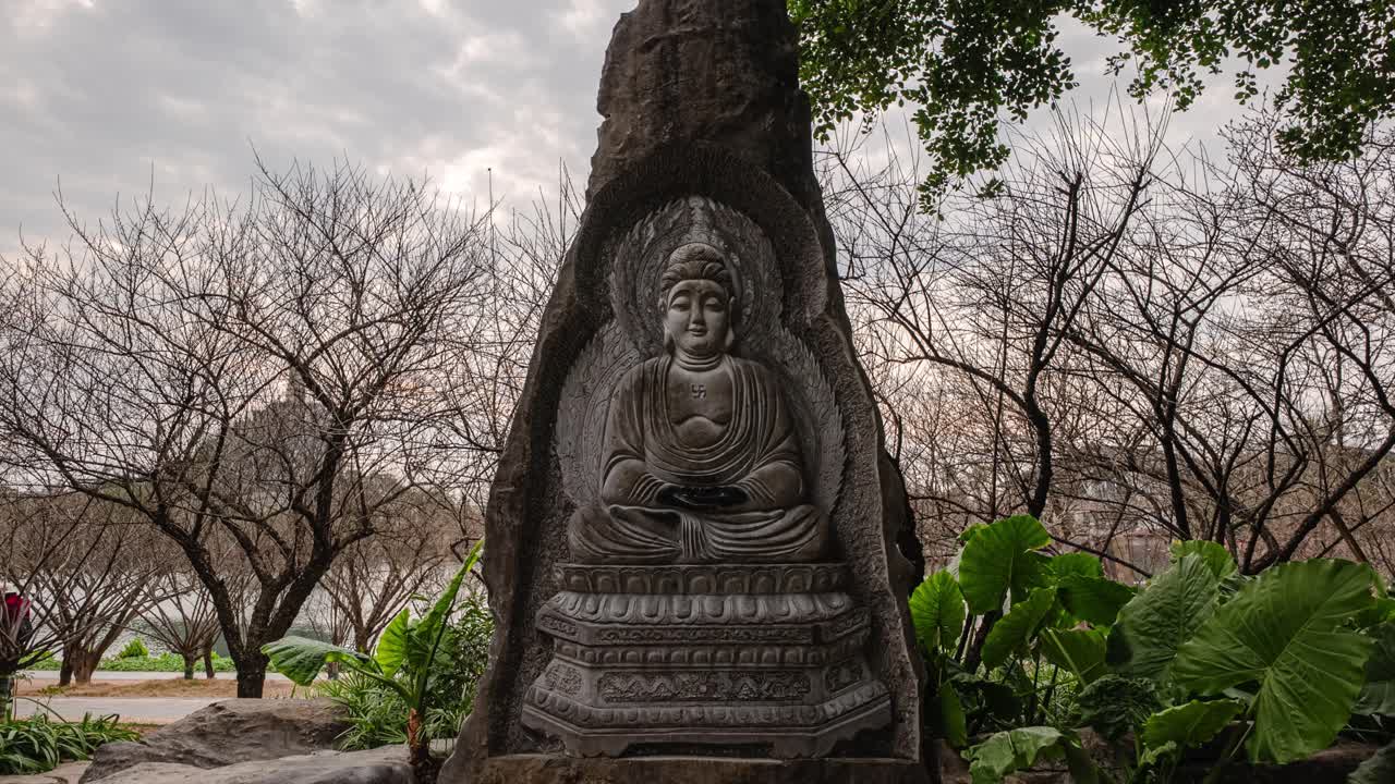 Hyperlapse of Serene Chinese Buddha Stone Statue at Sunset