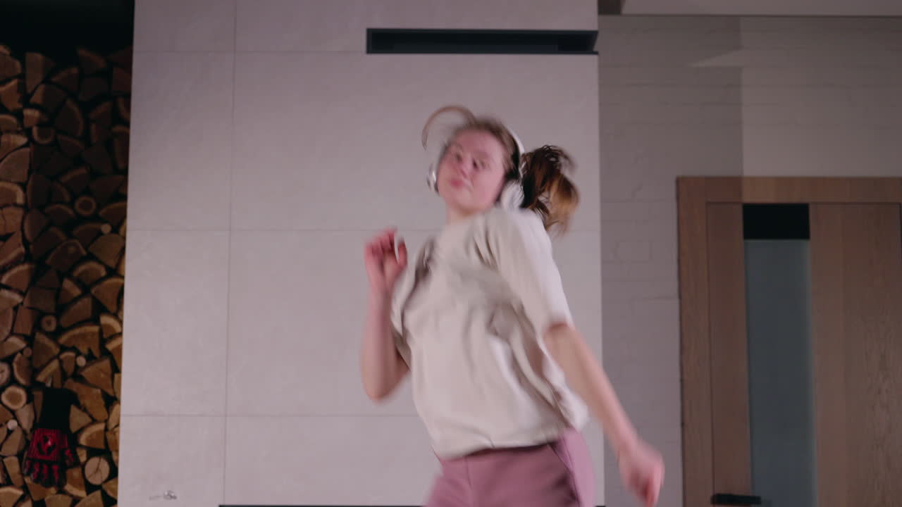 Woman Dancing at Home with Headphones