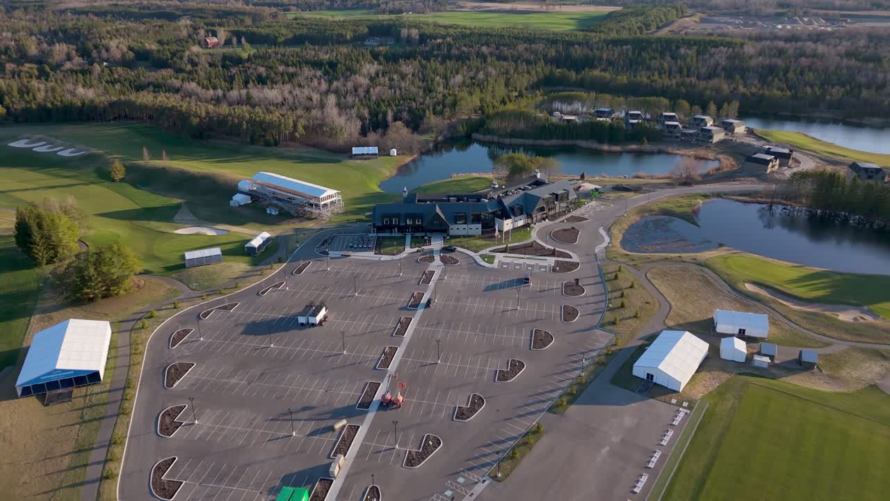 Empty Parking Lot And Clubhouse At TPC Toronto at Osprey Valley In Alton, Caledon, Ontario, Canada. - aerial shot