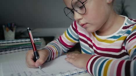 Elementary-age-girl-studying-at-the-desk